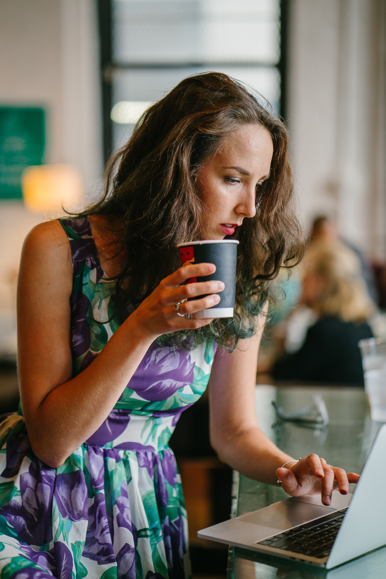 woman with coffee on laptop